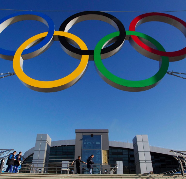 Image: The Olympic rings are on display in front of a newly-built railway station in Sochi